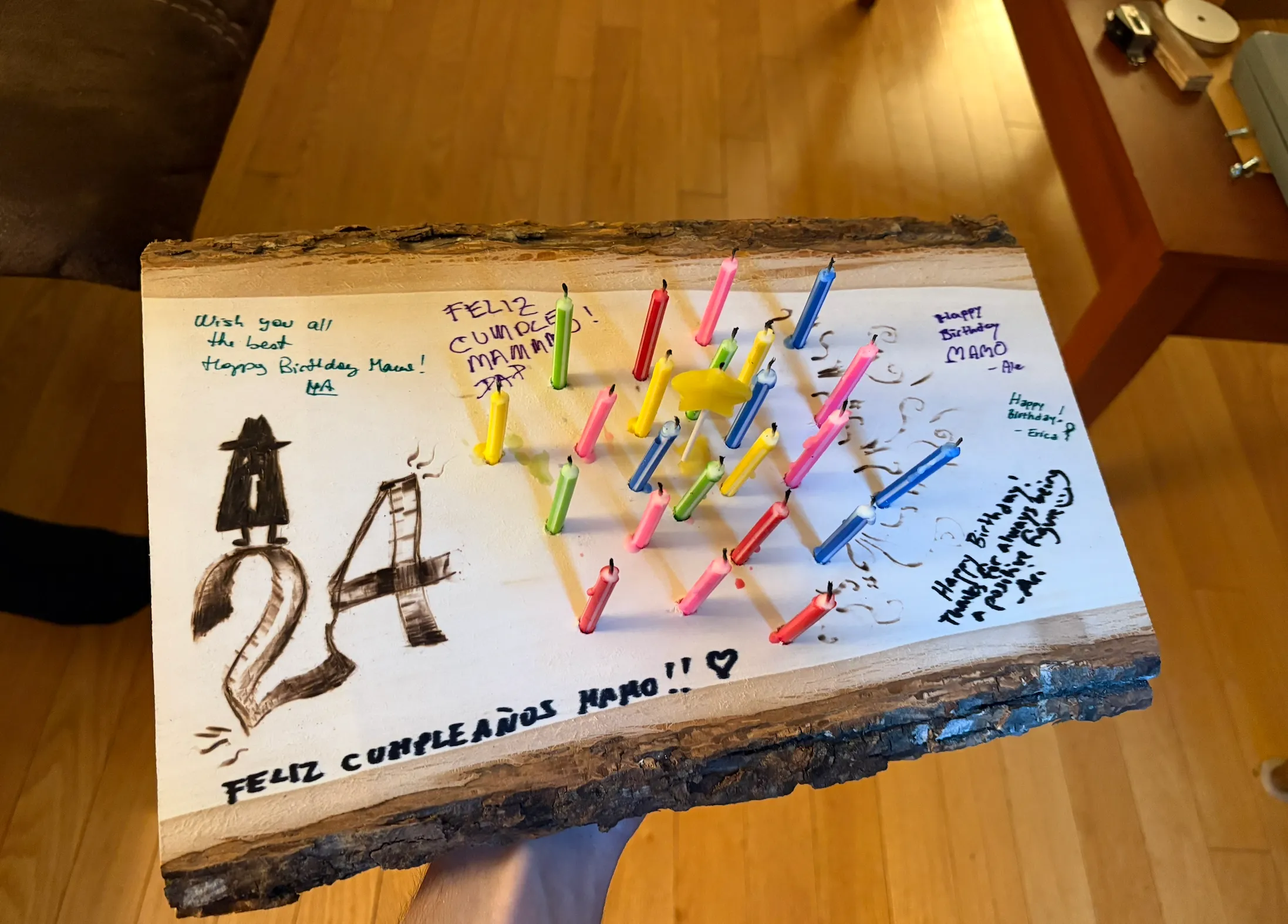 A piece of wood decorated to look like a birthday cake