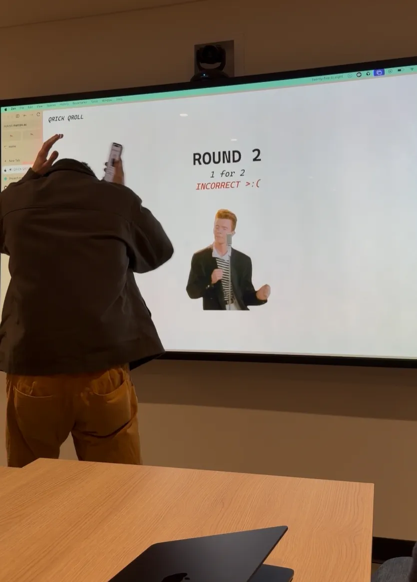 I duck and clutch my head as Rick Astley dancing appears on the projector